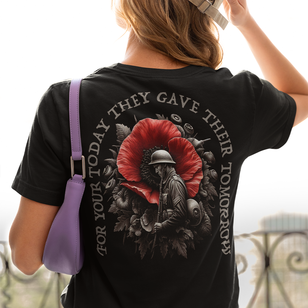 Back view of woman wearing black short sleeve unisex fit original T-Shirt by Achilles Tactical Clothing Brand Sacrifice Poppy and soldier design