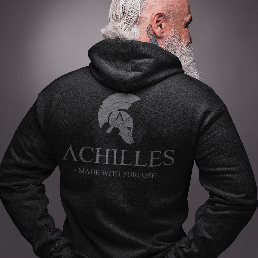 Close up of Back of man wearing Black unisex fit Pullover Hoodie by Achilles Tactical Clothing Brand printed with Large Signature design across back