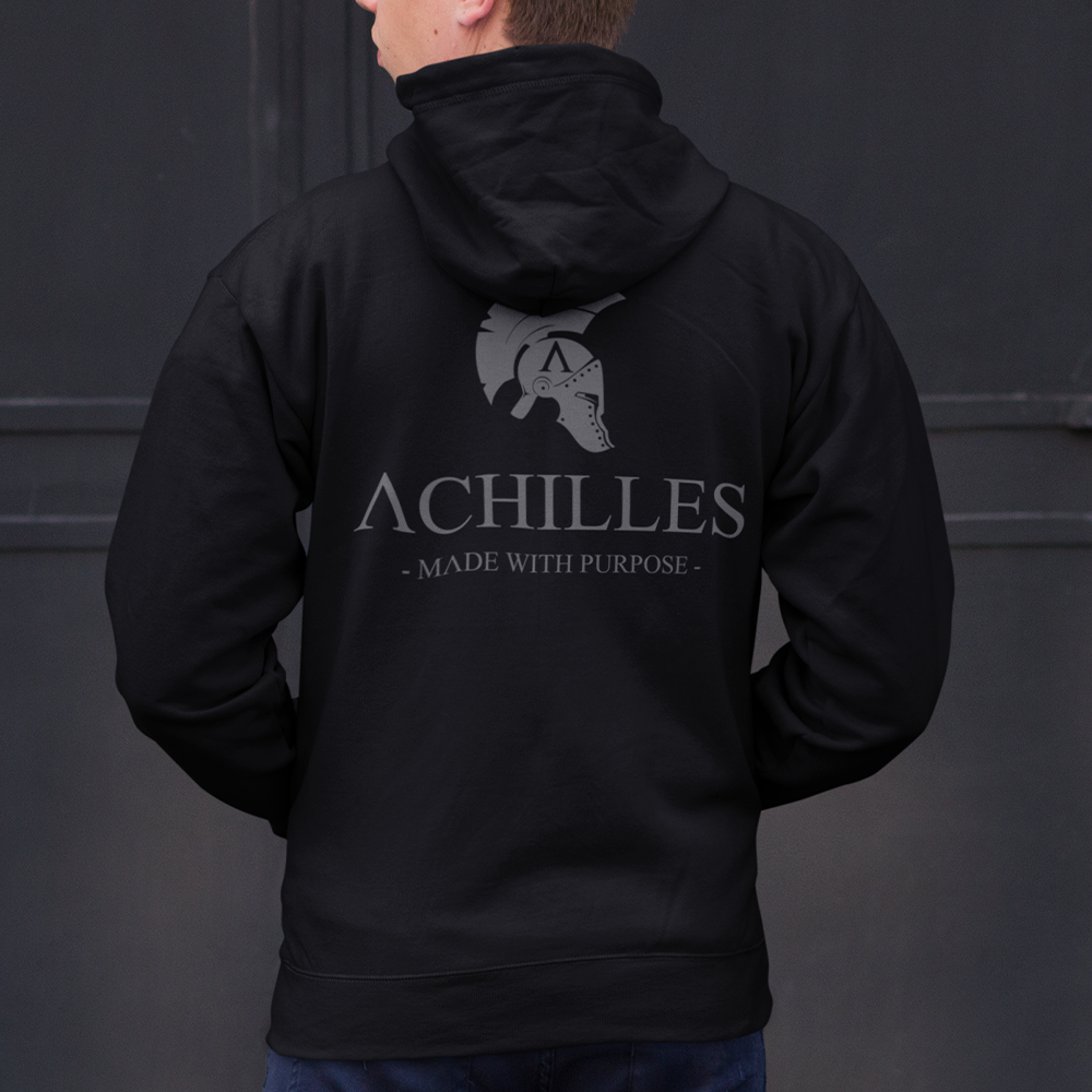 Close up of back of man wearing Black unisex fit Pullover Hoodie by Achilles Tactical Clothing Brand printed with Large Signature design across back