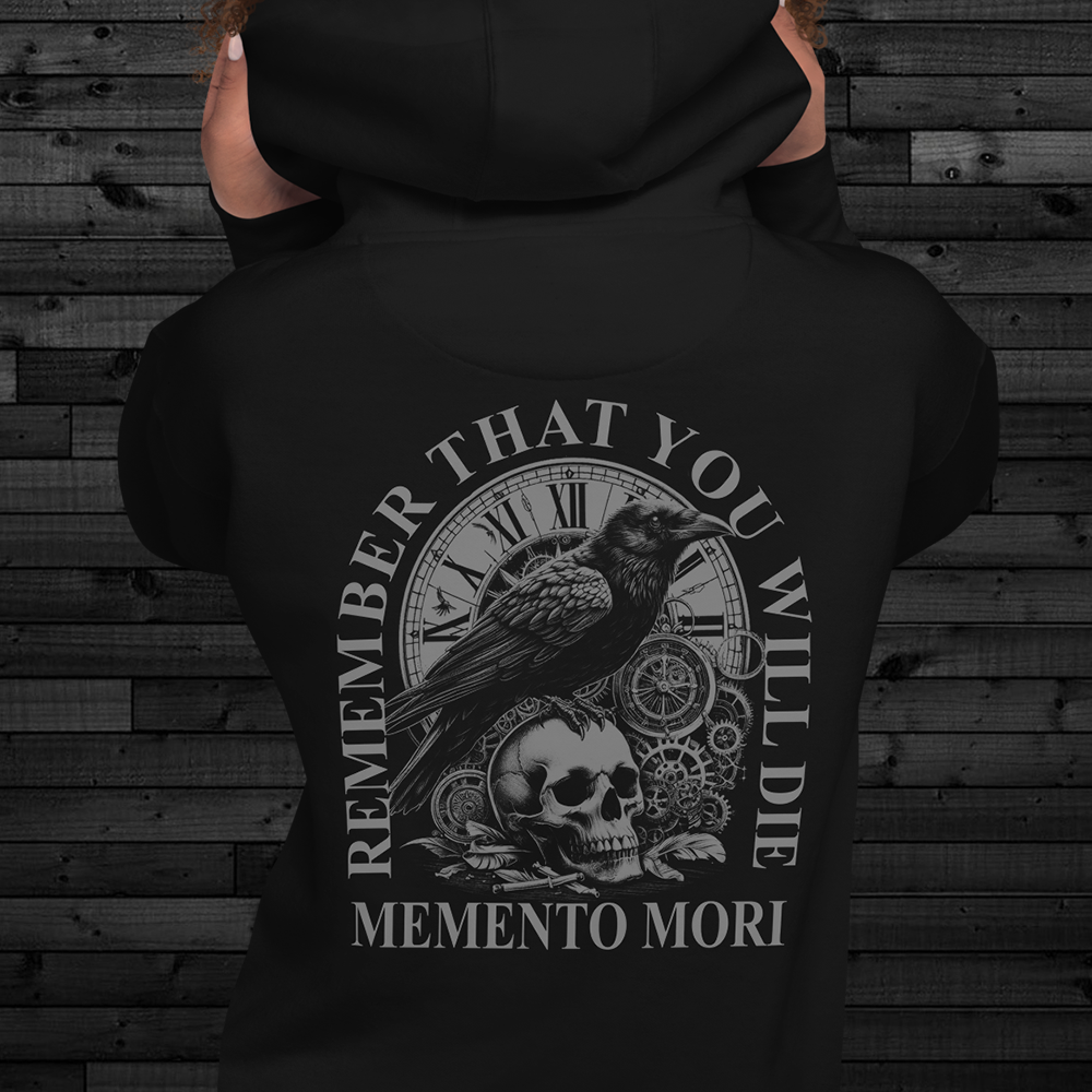 Close up of back of woman wearing back view of Black unisex fit Pullover Hoodie by Achilles Tactical Clothing Brand printed with Large Memento Mori design across back