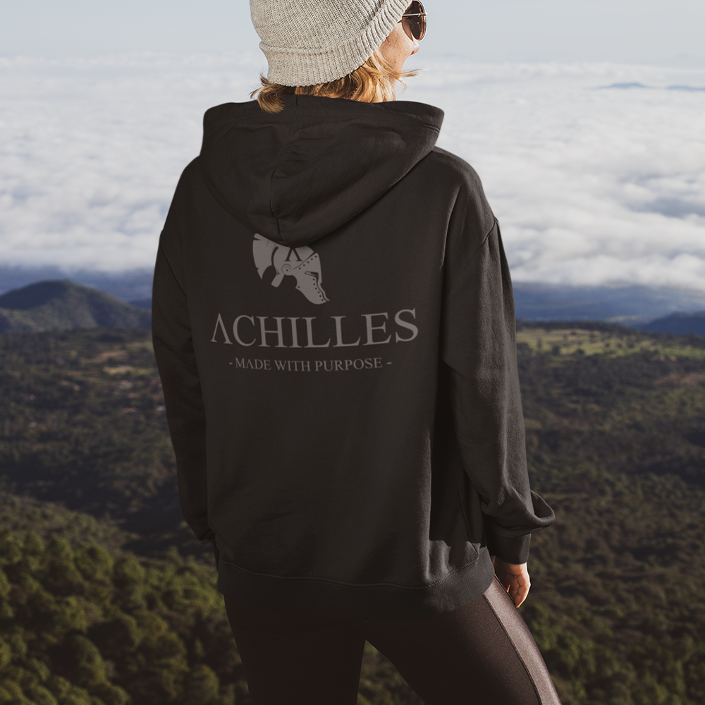 Close up of back of woman wearing Black unisex fit Pullover Hoodie by Achilles Tactical Clothing Brand printed with Large Signature design across back