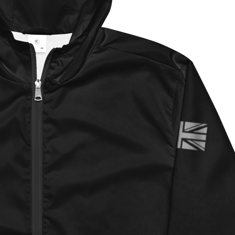 Close up of front chest of Black long sleeve unisex fit windbreaker track jacket by Achilles Tactical Clothing Brand printed with Achilles signature logo across back