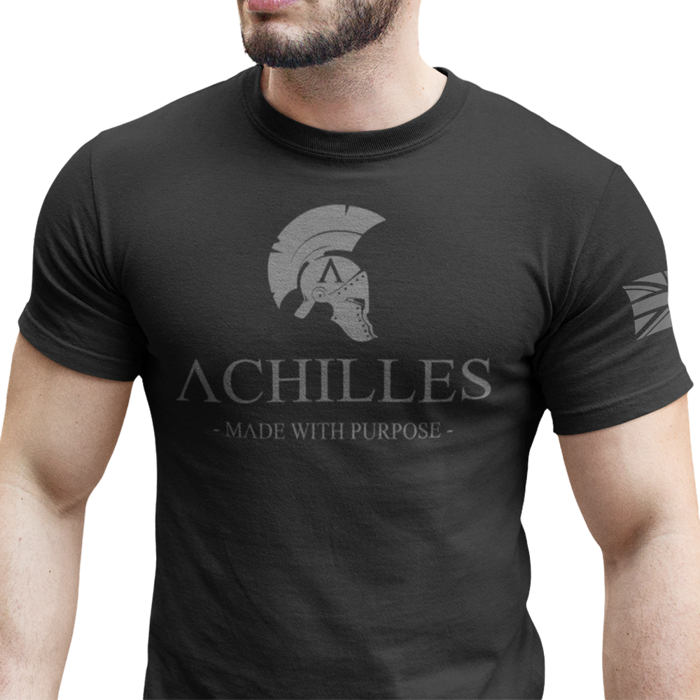 Front view of man wearing Black short sleeve classic cotton unisex fit T-Shirt by Achilles Tactical Clothing Brand with screen printed Signature design